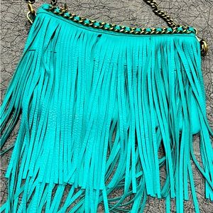 Turquoise leather fringe boutique purse. In like new condition.